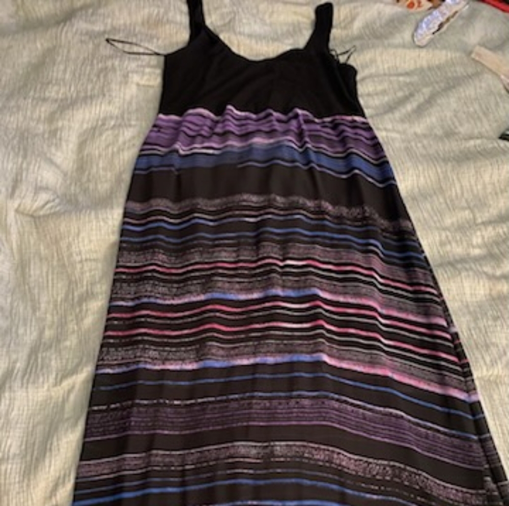 New without tag. Long dress but from knees to ankles is see through.